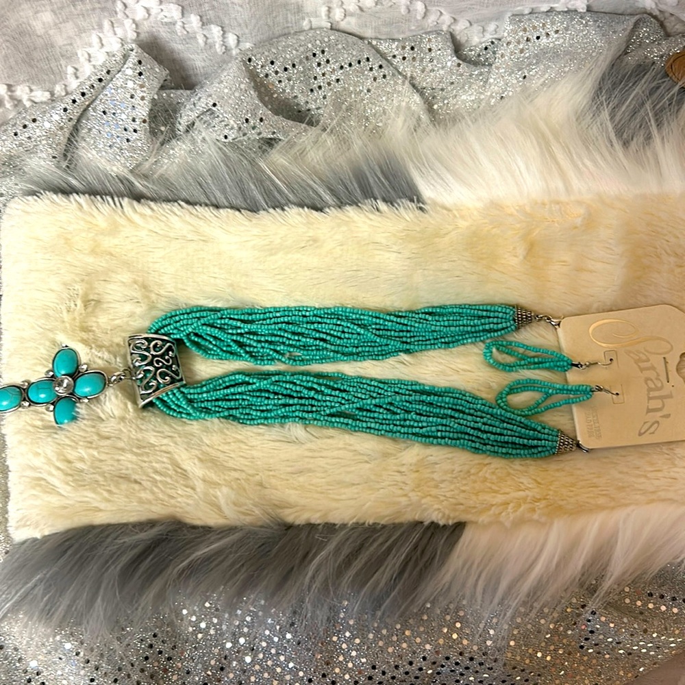 New necklace and earrings. Silver toned accents.